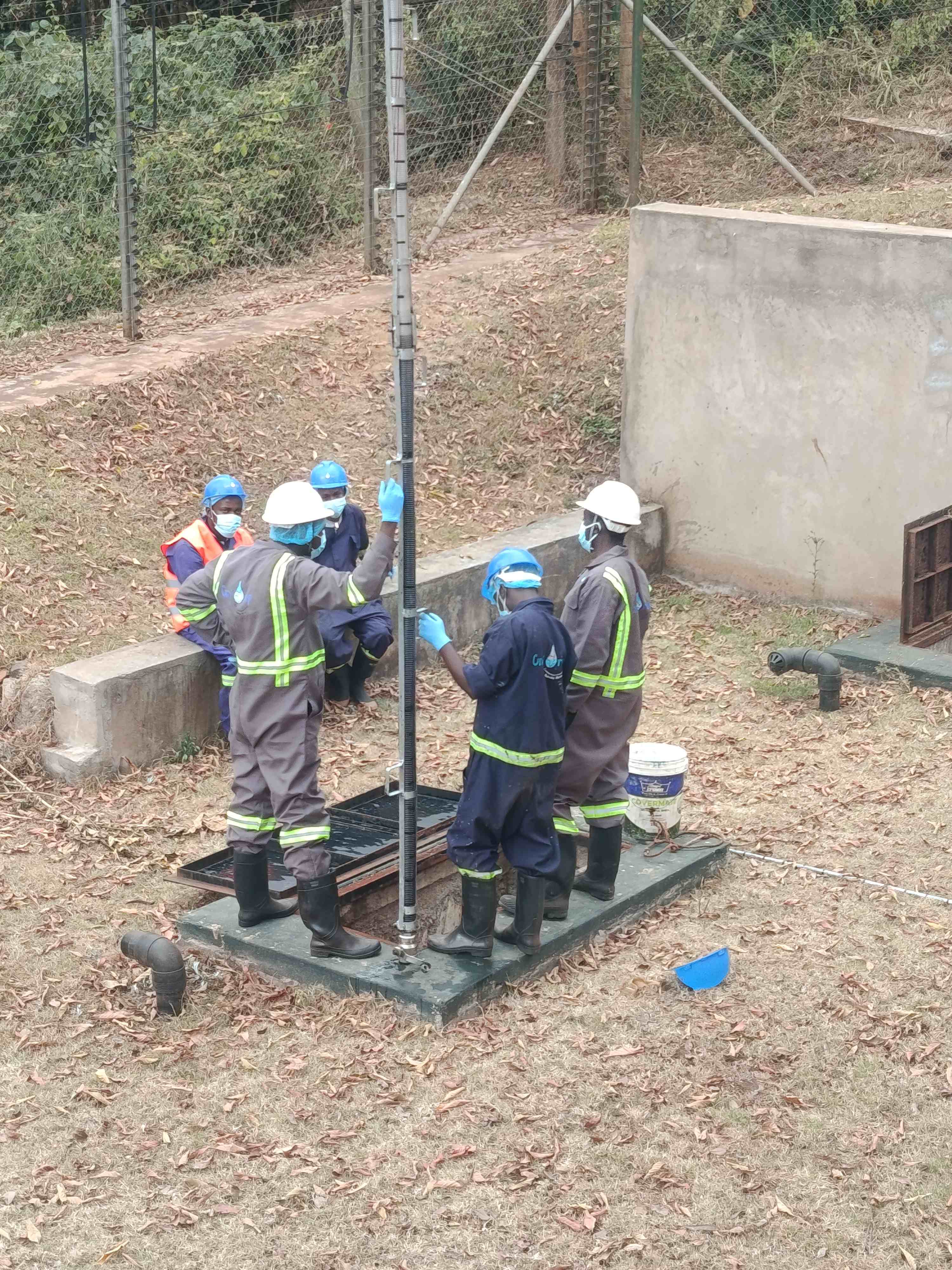 Omidrop Africa auditor inspecting institutional water and sanitation infrastructure for a WASH compliance report in Kenya